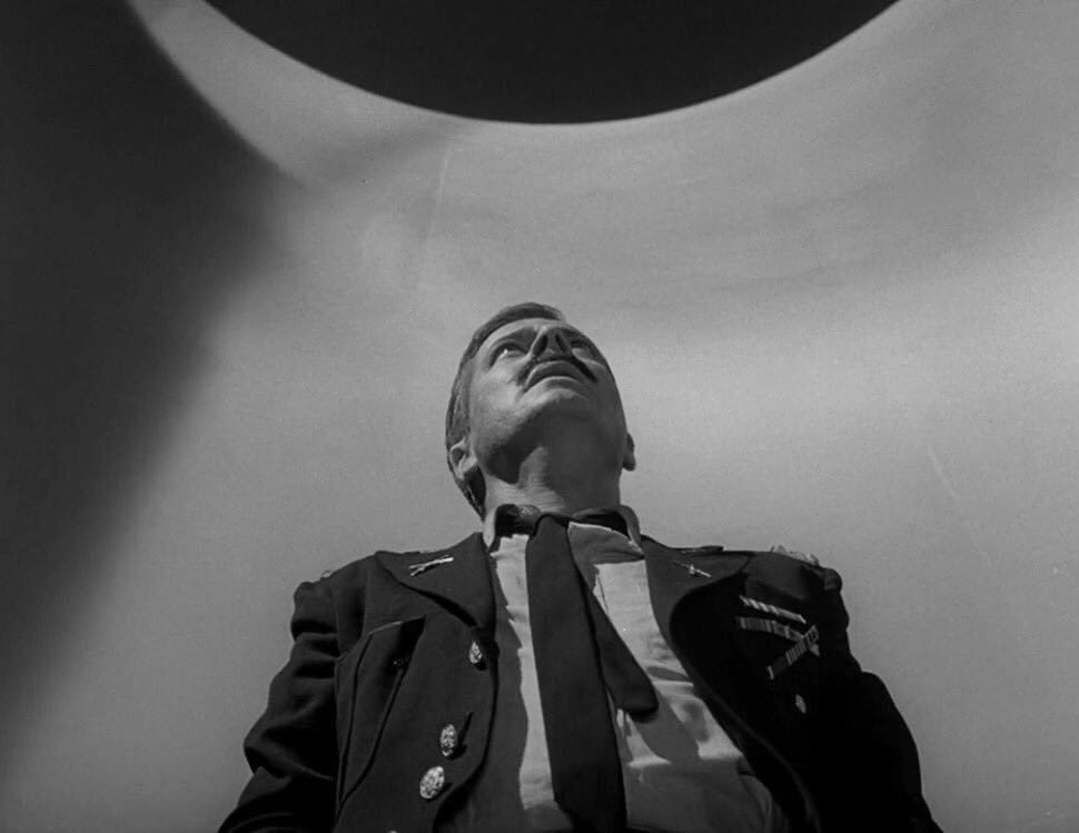 In 'Five Characters in Search of an Exit,' which of these is NOT one of the five figures trapped inside the mysterious cylinder?