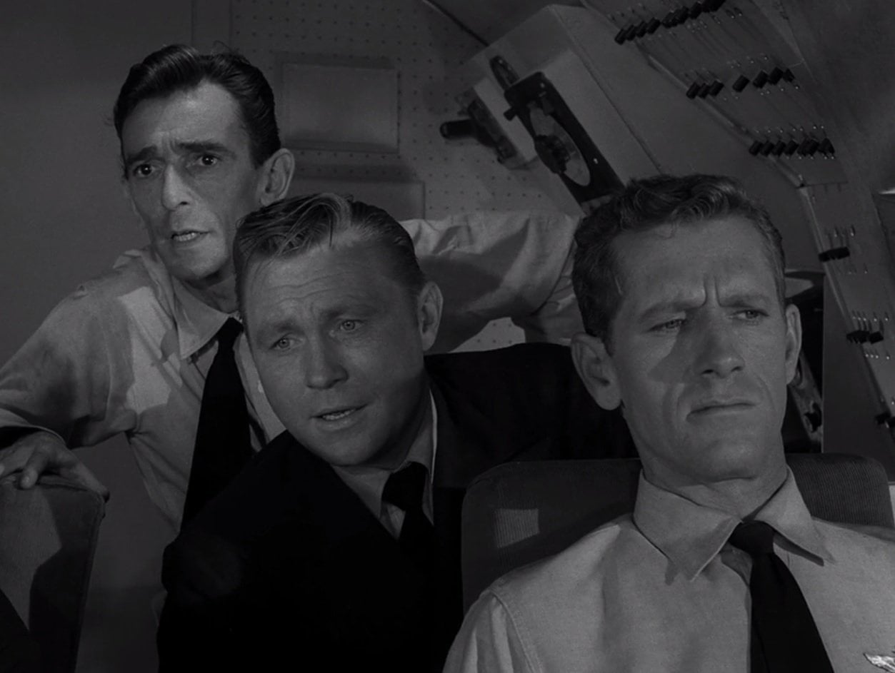 In 'The Odyssey of Flight 33,' what do the crew and passengers see after their airliner first travels backward through time?